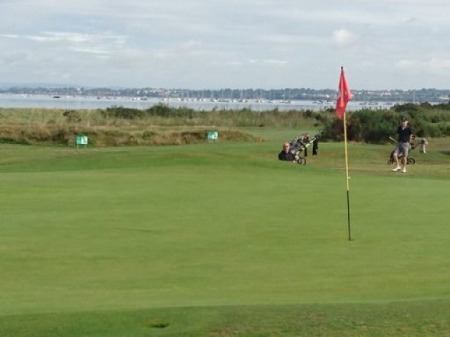 Warren 10th green with Exe estuary behind