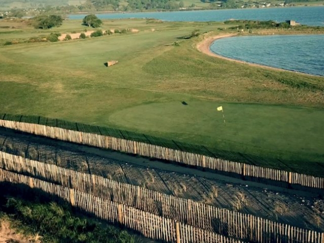Aerial view of 6th green with lagoon